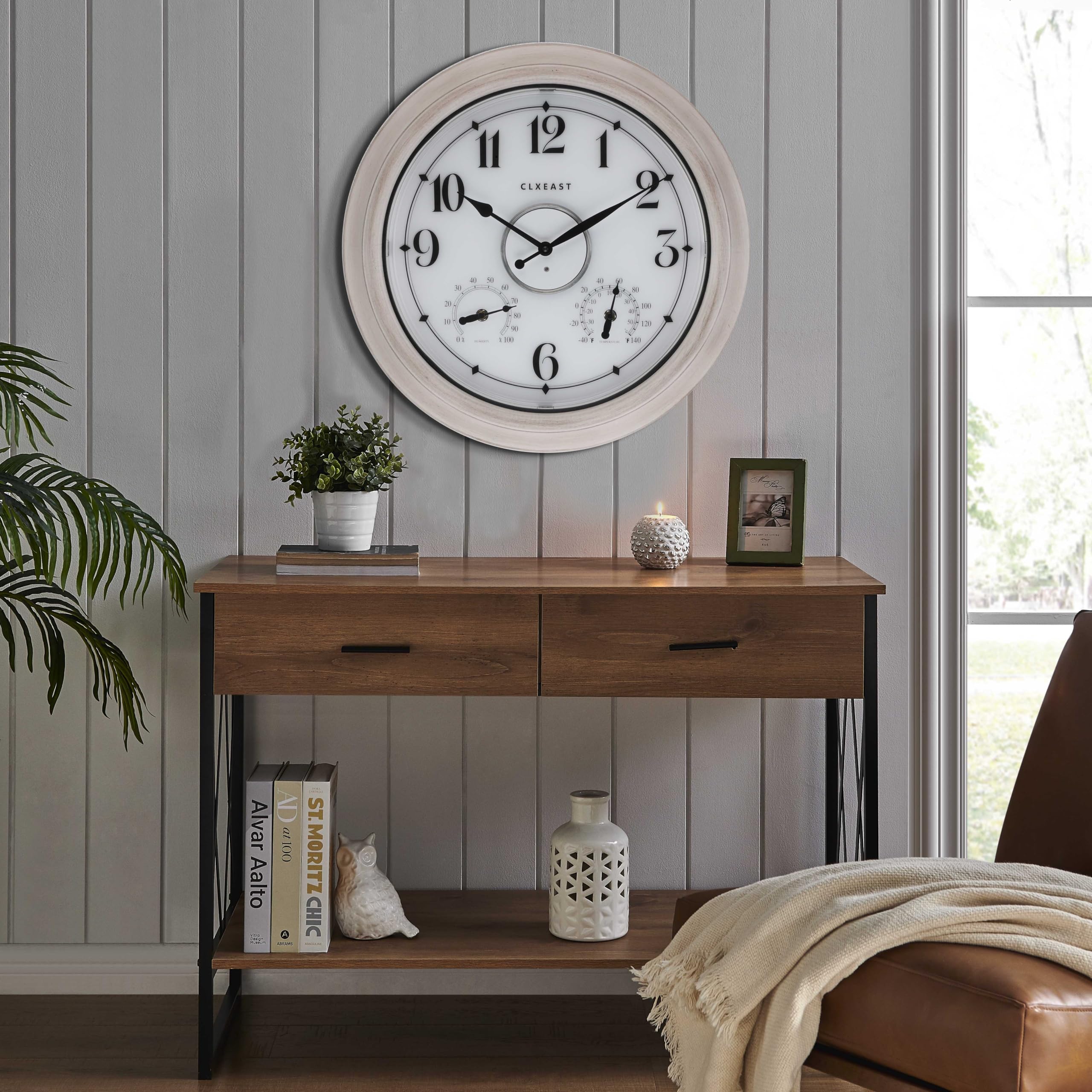 Lifestyle shot of CLXEAST outdoor clock on a modern farmhouse porch