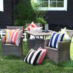 Lifestyle shot of pink pillow covers on outdoor patio furniture