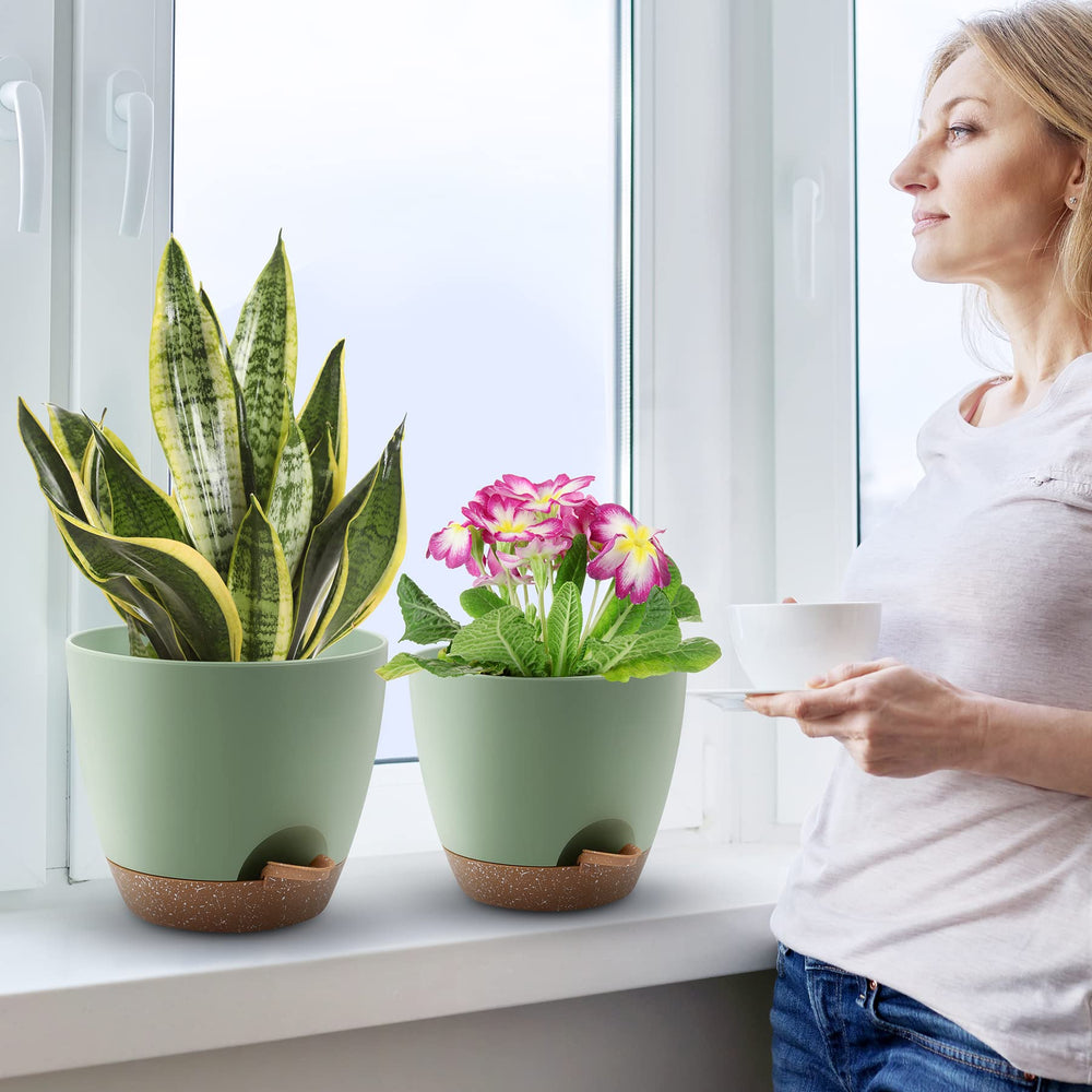 Lifestyle view of QRRICA self-watering pots in a garden