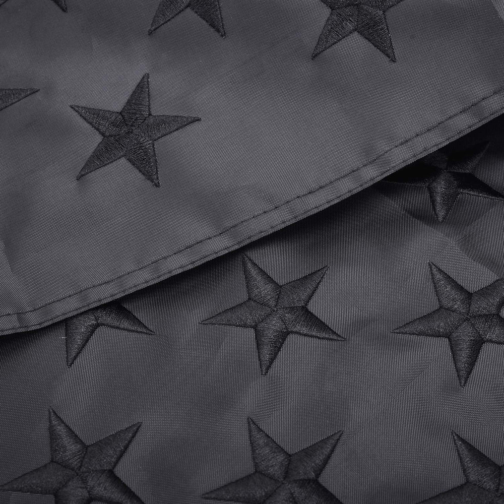 Lifraon Black American Flag hanging in a garden