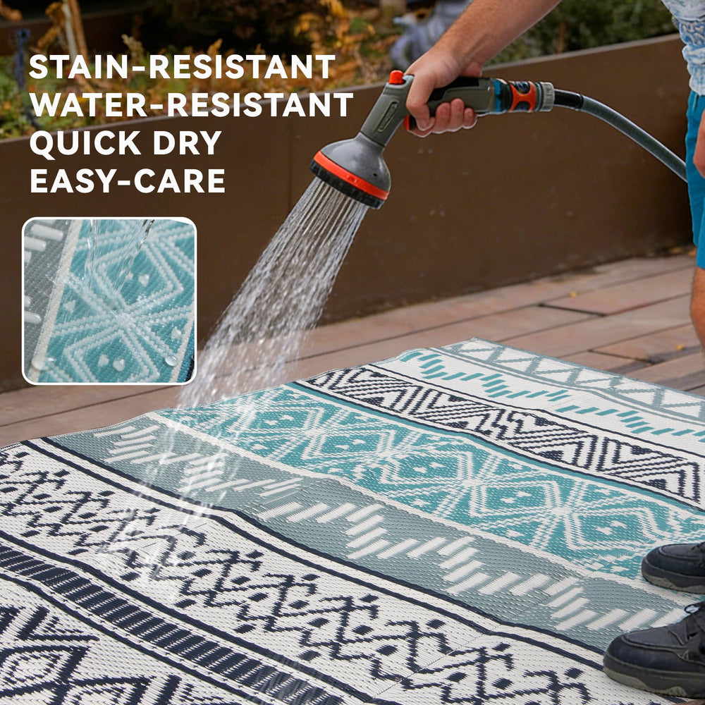 Lightweight Strickland Home Outdoor Rug folded in carrying bag