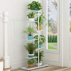 LINZINAR 7 Tier Plant Stand in a garden setting
