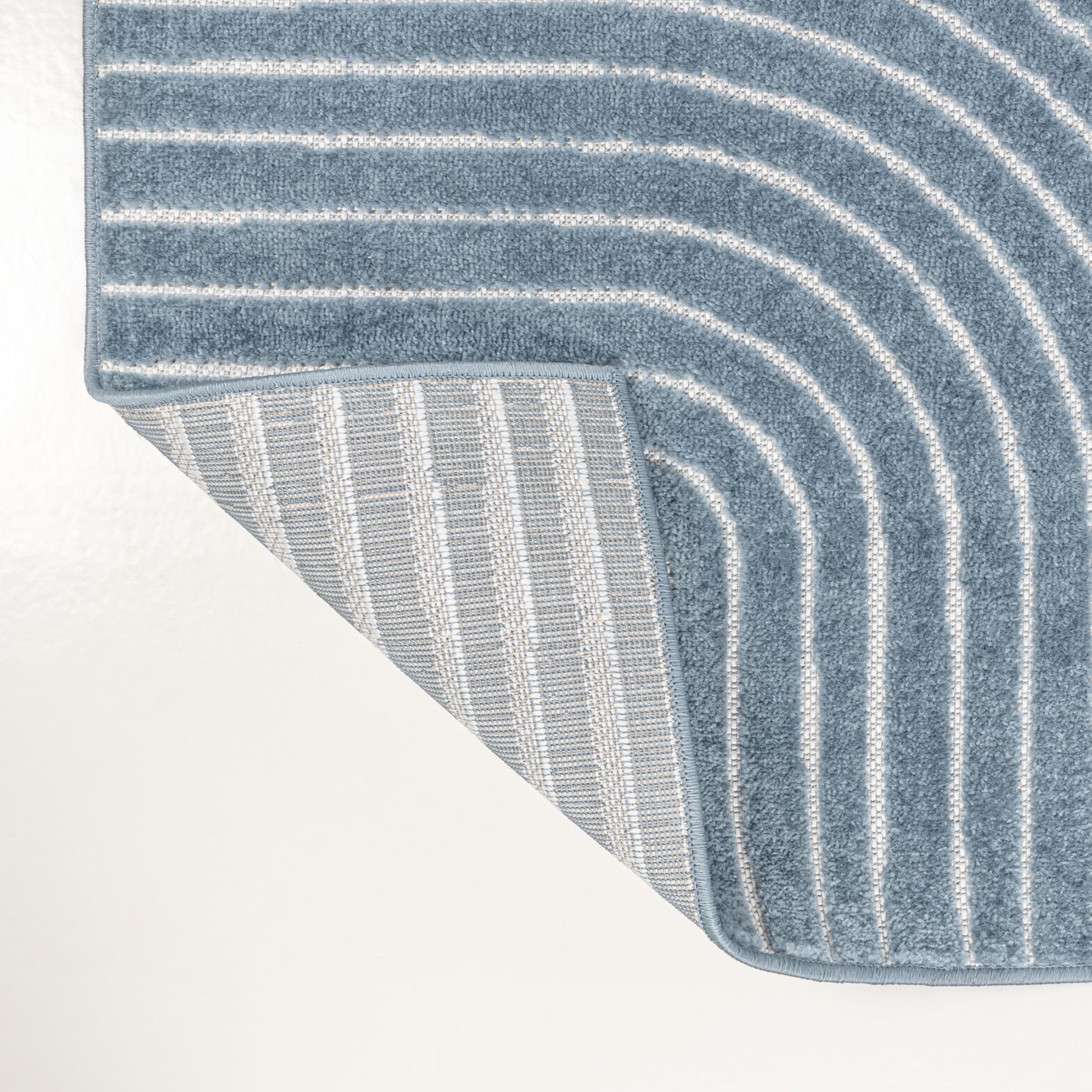 Living room featuring JONATHAN Y Hallie High-Low Curve Rug
