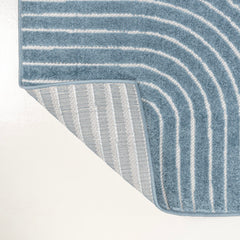 Living room featuring JONATHAN Y Hallie High-Low Curve Rug