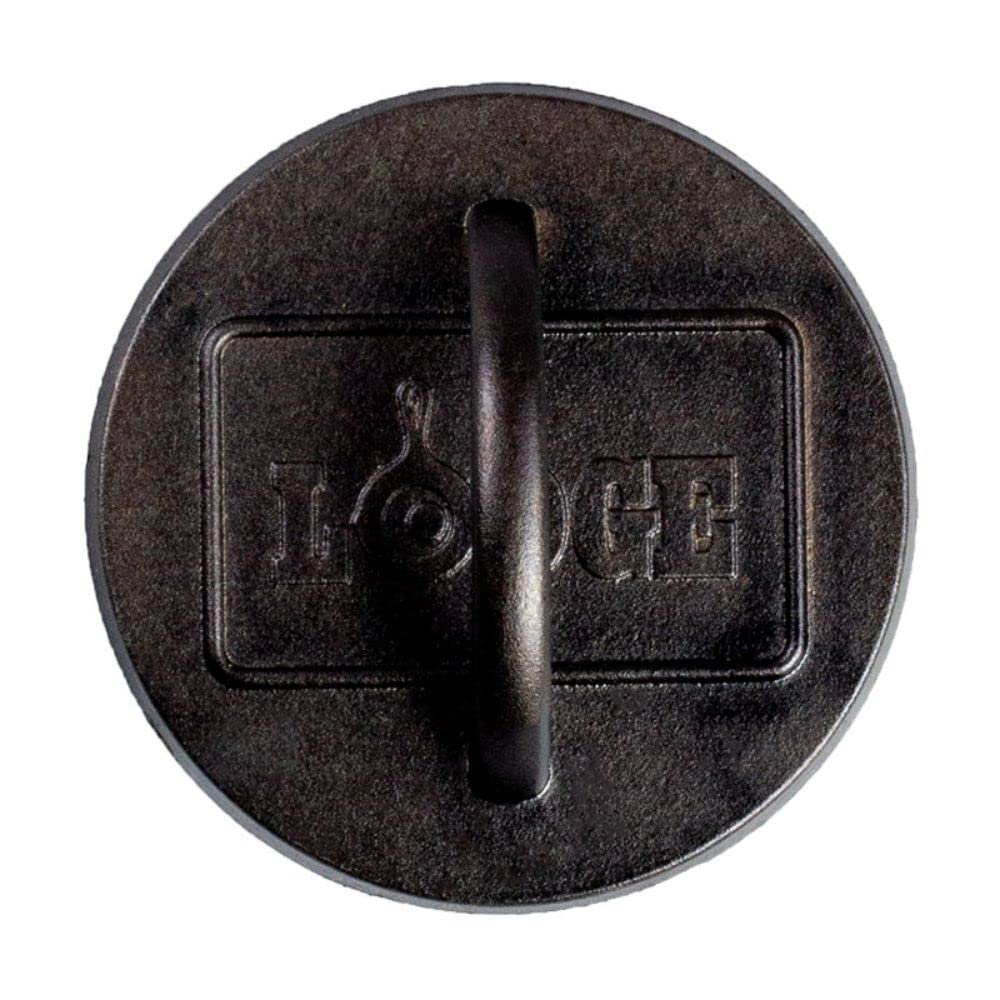 Lodge burger press on a grill with burgers