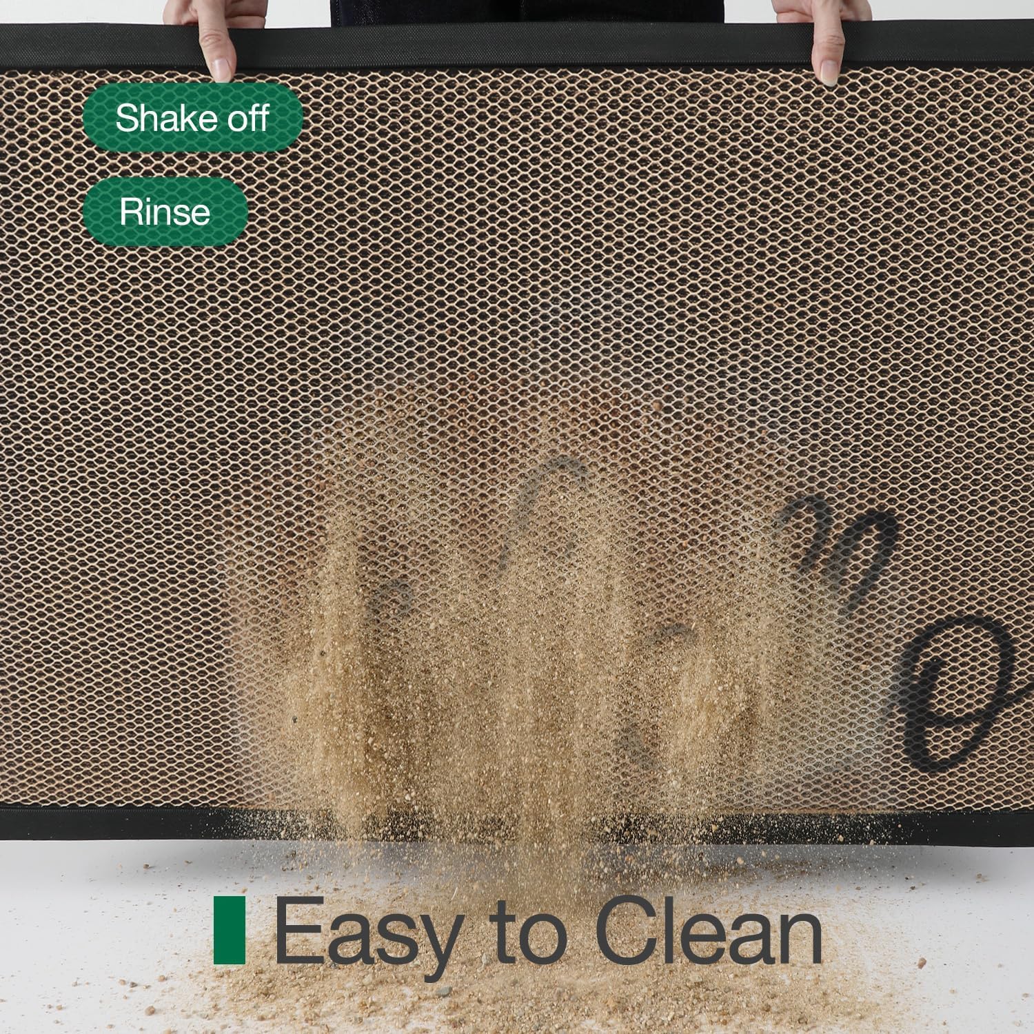 LUMI Welcome Door Mat being rinsed with a hose