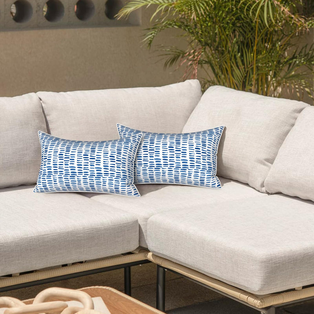 LVTXIII Outdoor Lumbar Pillow Cover in A Pebble Blue on a garden bench