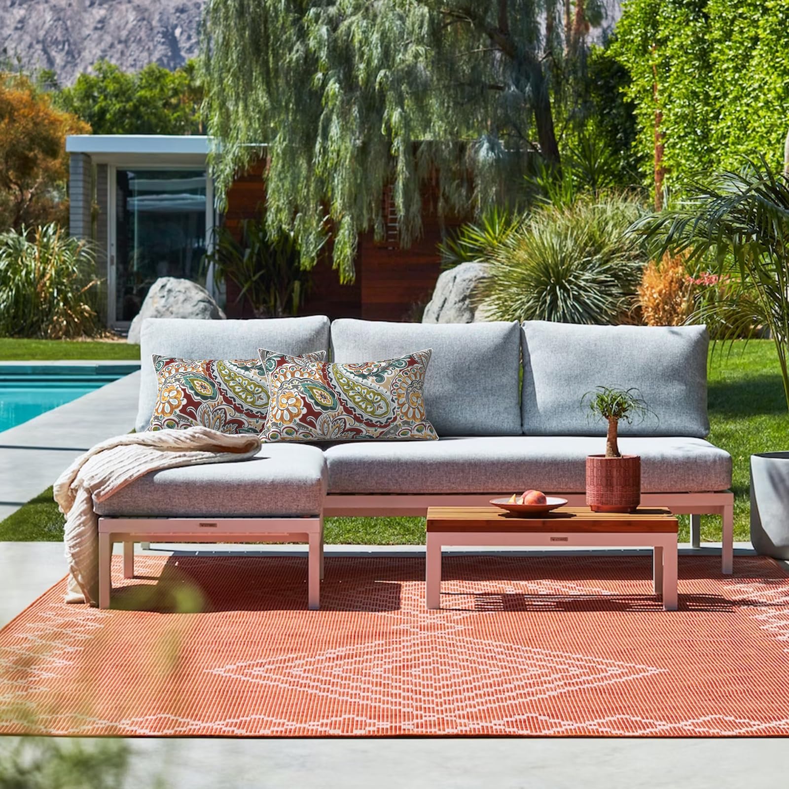 LVTXIII Outdoor Lumbar Pillow Cover on a patio lounge chair