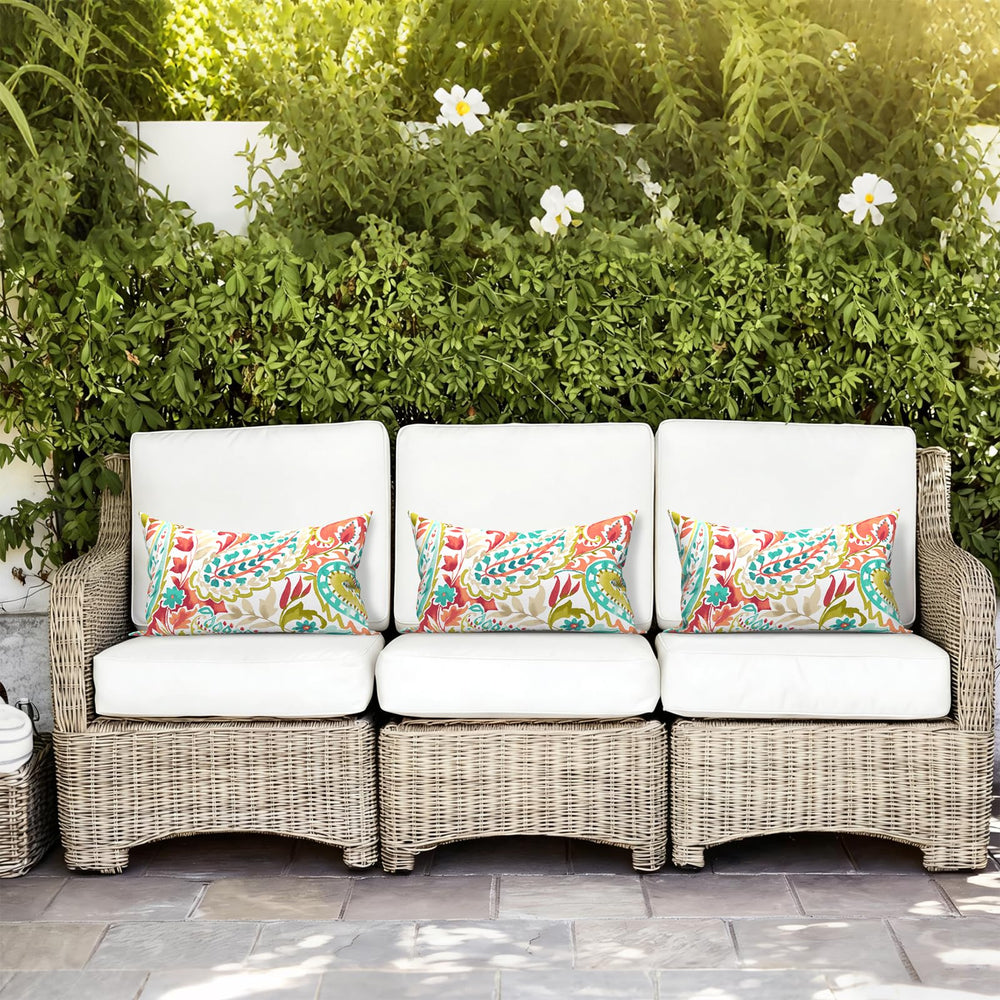 LVTXIII Outdoor Lumbar Pillow in a decorative outdoor setting