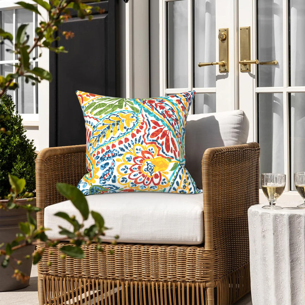 LVTXIII pillow covers in vibrant paisley design on sofa
