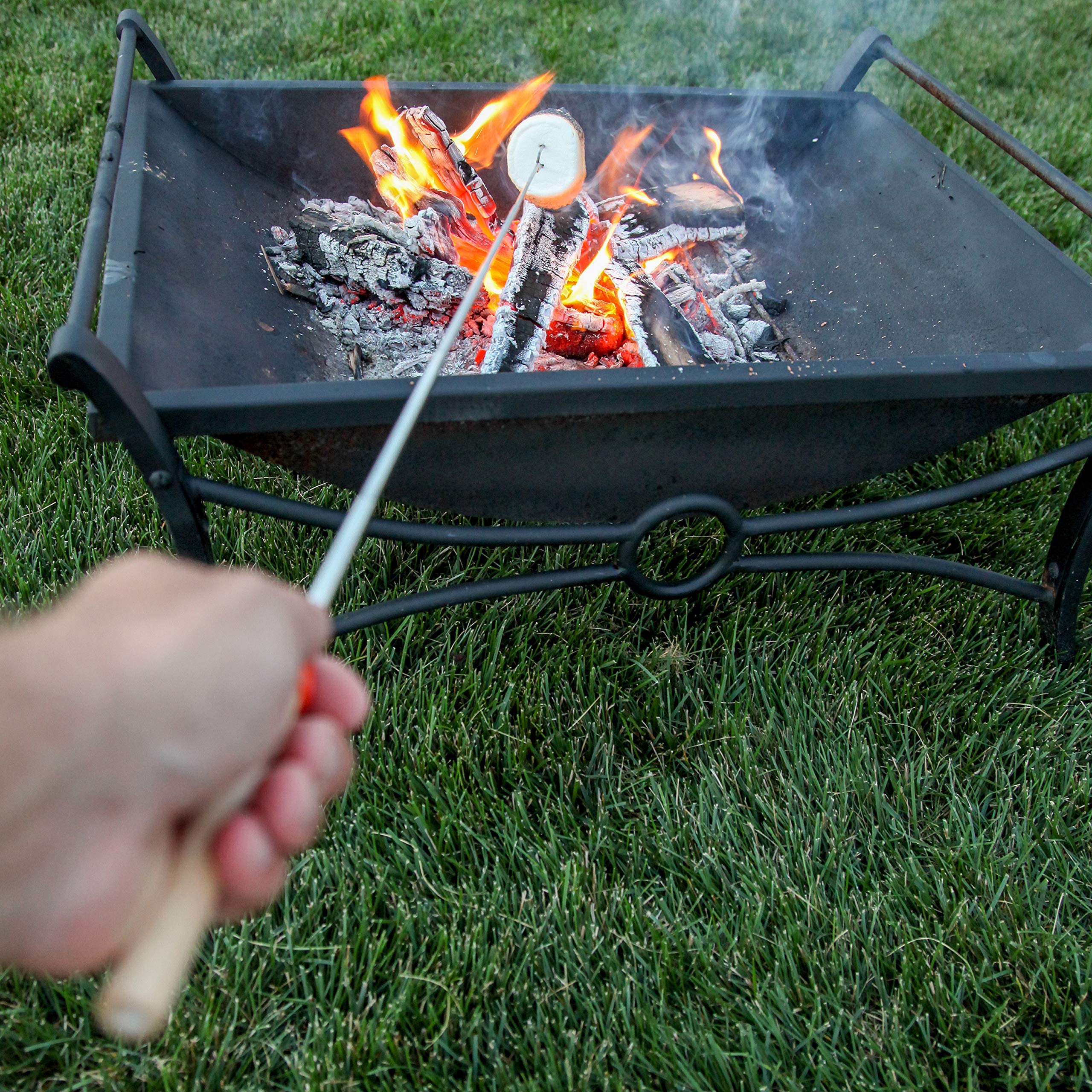 MalloMe S'mores Stick set laid out on a picnic table