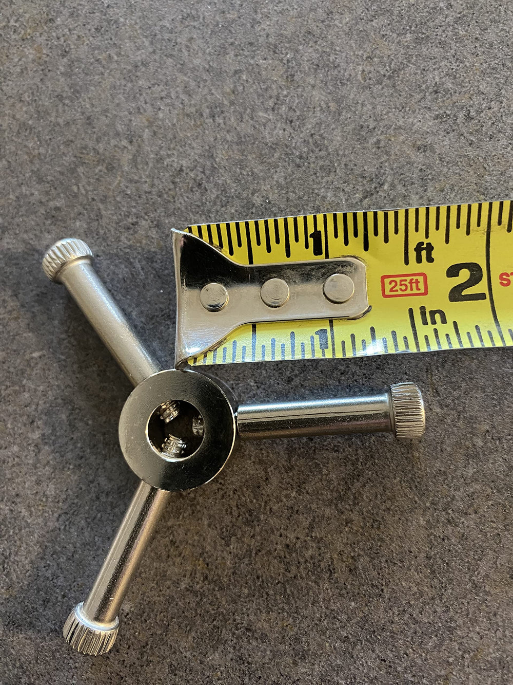 Mandle handle beside other watering equipment