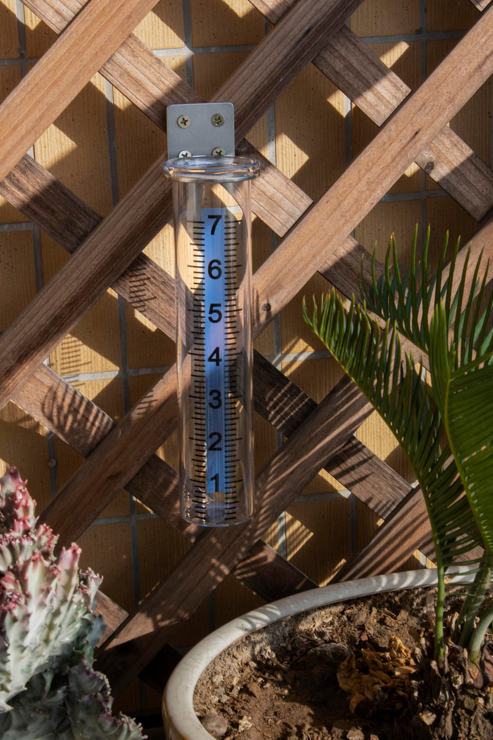 Mateda rain gauge in outdoor garden setting