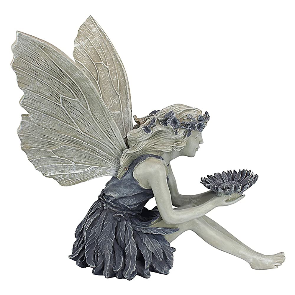 MBVBN Angel Fairy Statue placed in a garden setting