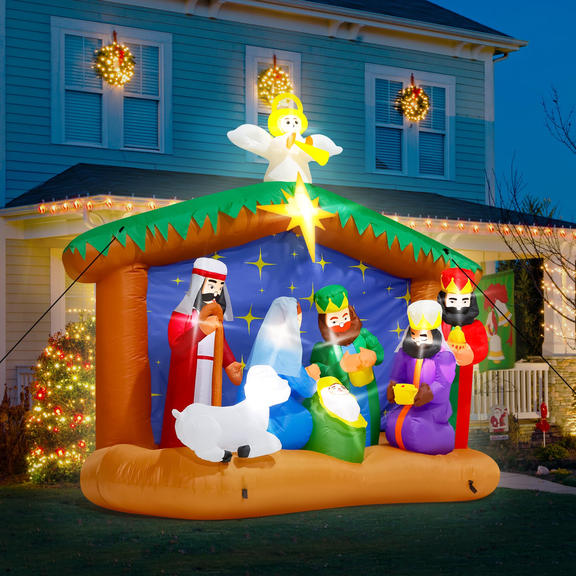 Melisheer inflatable Nativity scene lit up at night in a yard