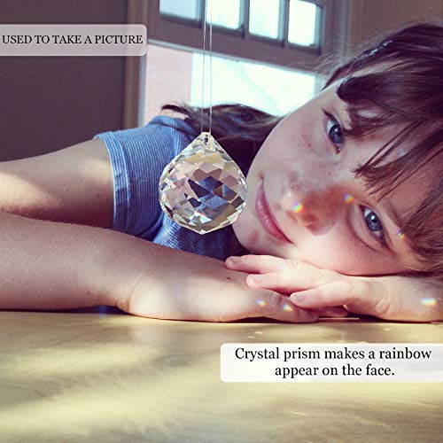 MerryNine Clear Crystal Sun Catcher Prism Balls hanging in a window