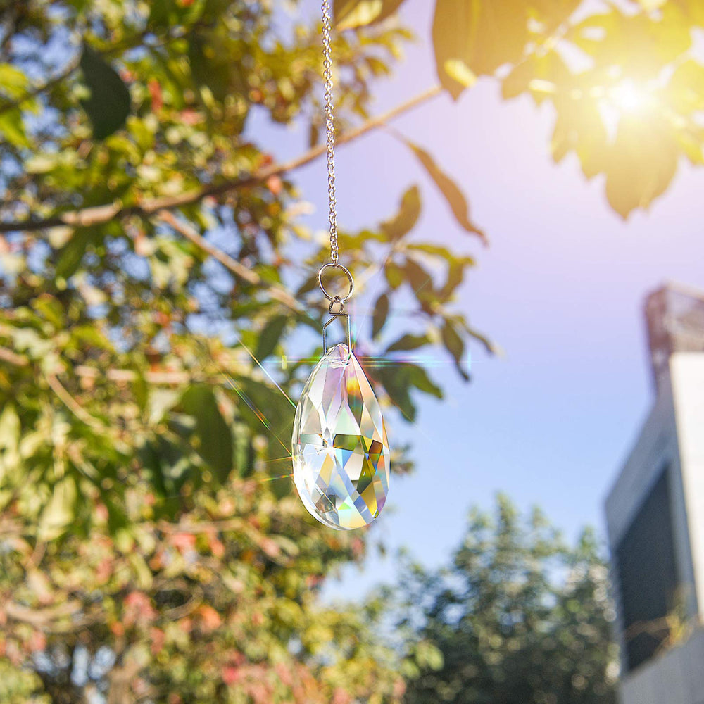 MerryNine sun catcher chains hanging in a garden