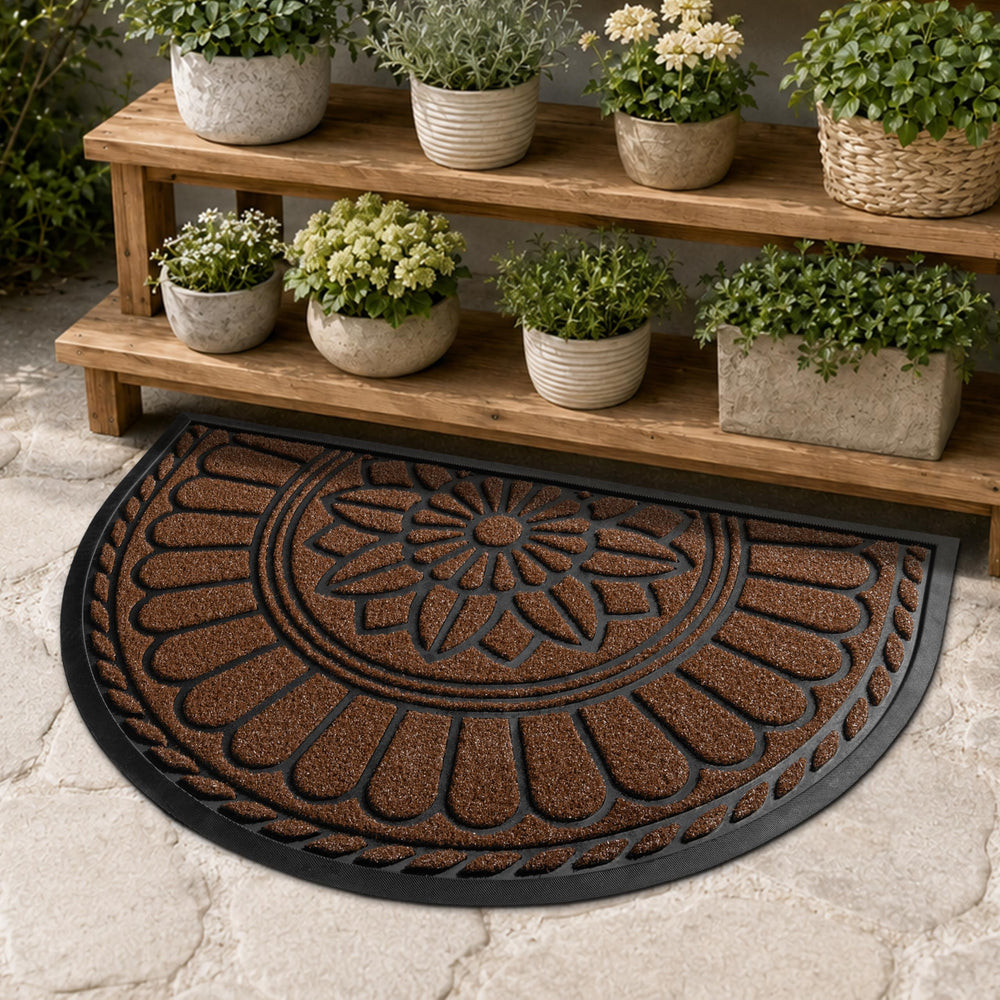 Mibao door mat being cleaned with garden hose