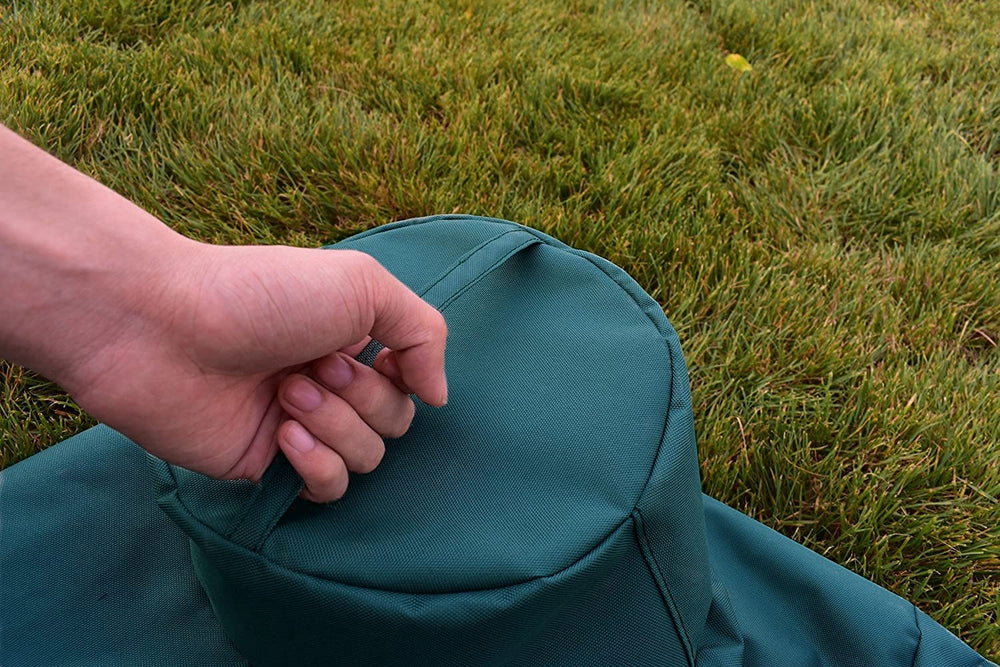 Mini Lustrous Grill Cover laid on a Medium Big Green Egg Grill