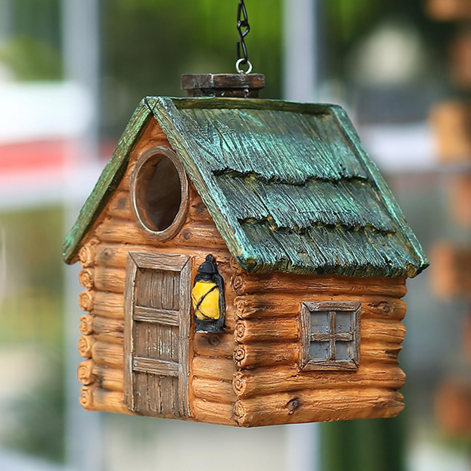 MINWOLF Bird House next to flowers in a garden setting