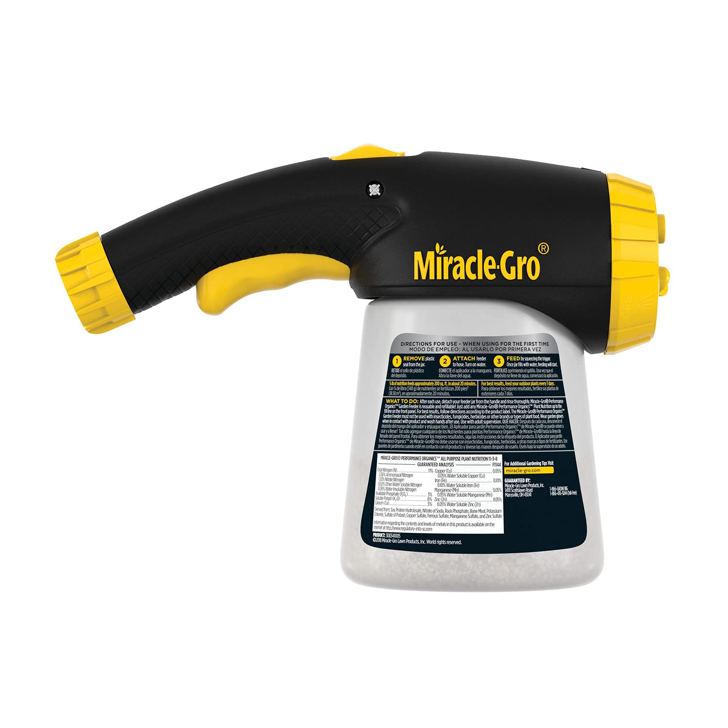 Miracle-Gro feeder alongside healthy garden plants