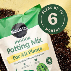 Miracle-Gro Indoor Potting Mix being poured into a container