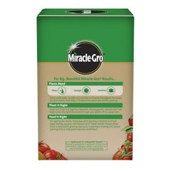 Miracle-Gro Tomato Plant Food powder being mixed with water