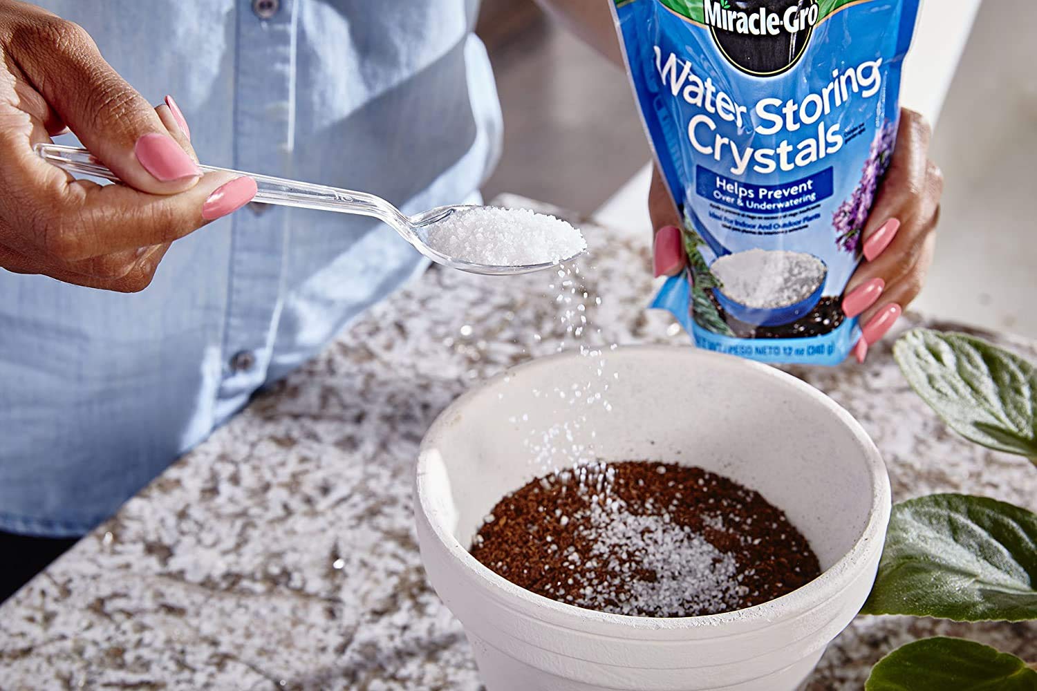 Miracle-Gro Water Storing Crystals being mixed with soil