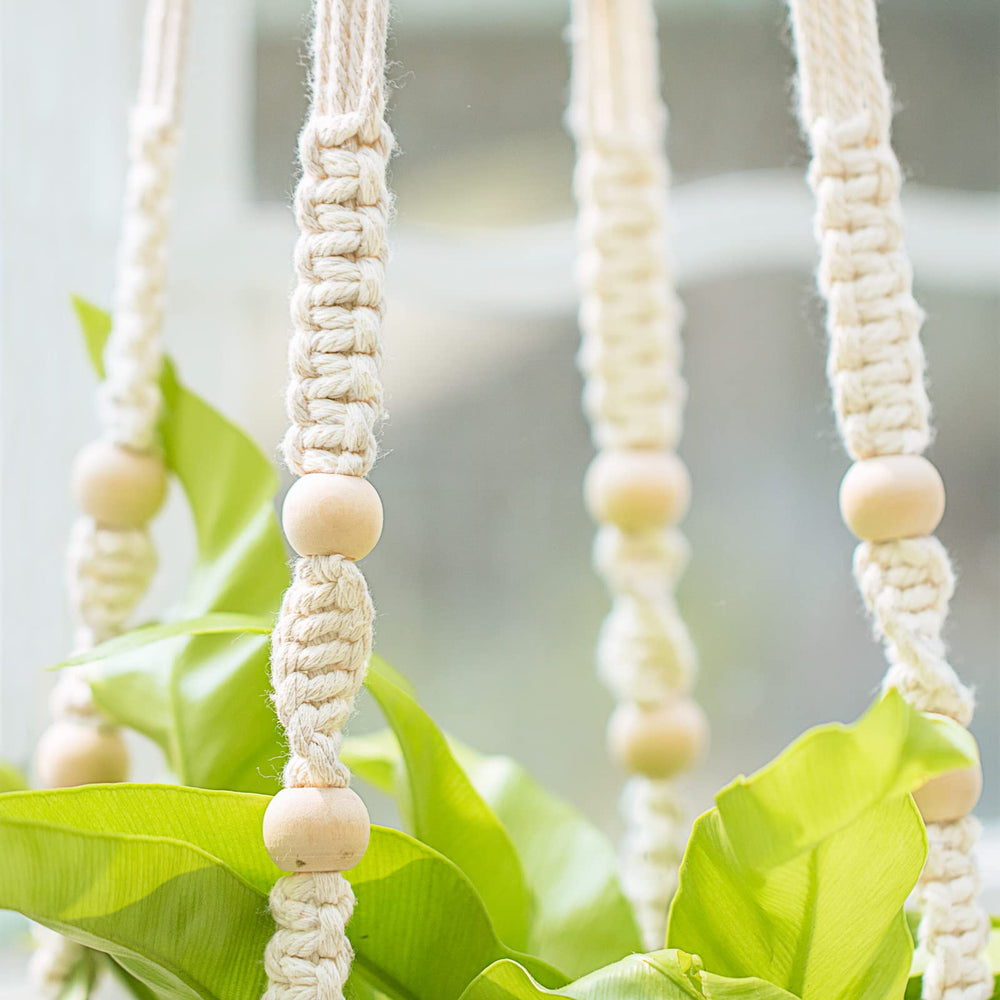 Mkono macrame hanger showcased outdoors on a balcony