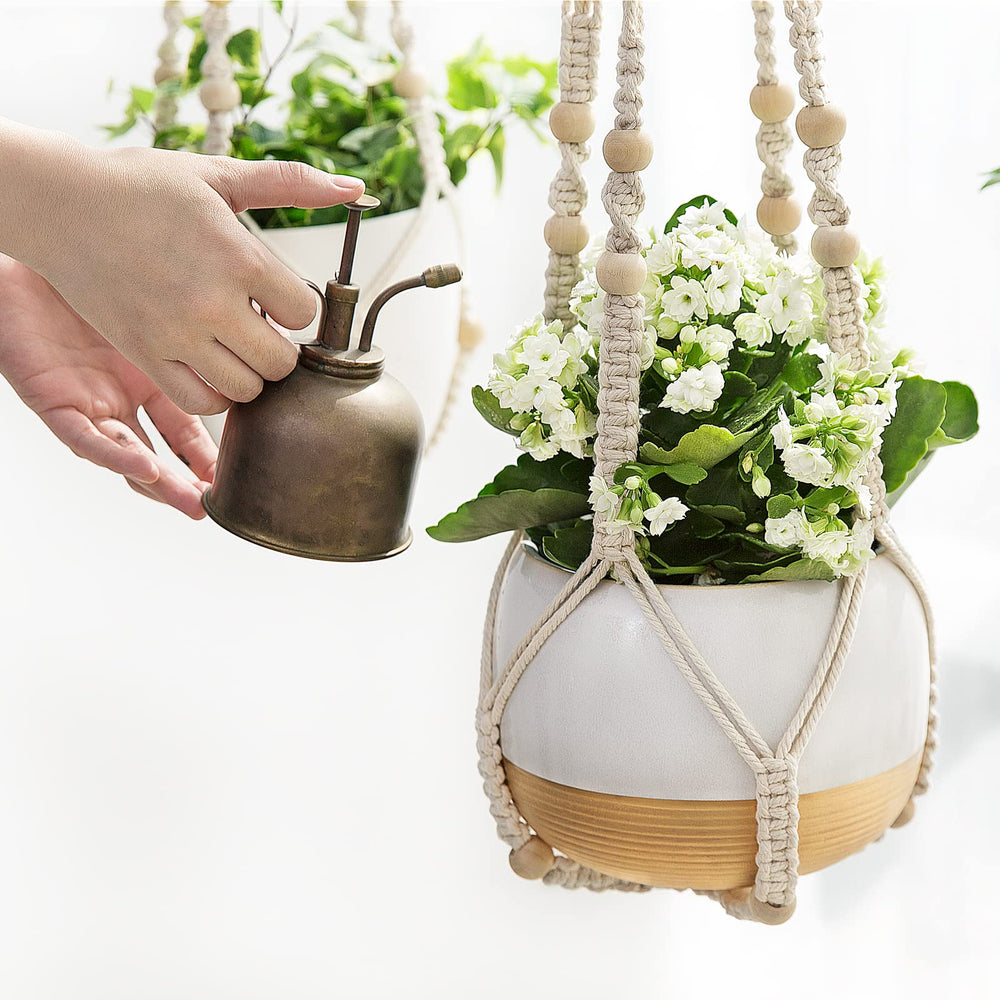 Mkono Macrame Plant Hanger 35 Inch displayed in a garden setting