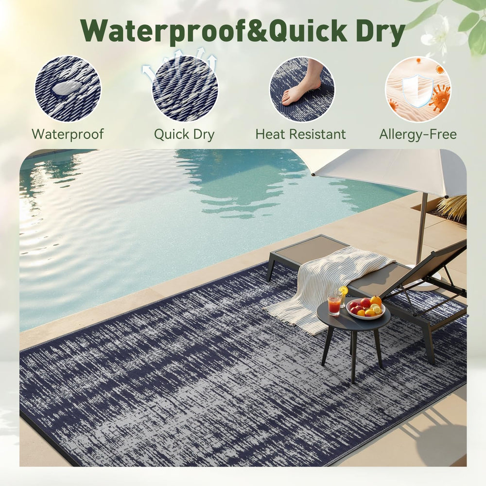MontVoo Outdoor Rug 6x9 ft navy blue on patio