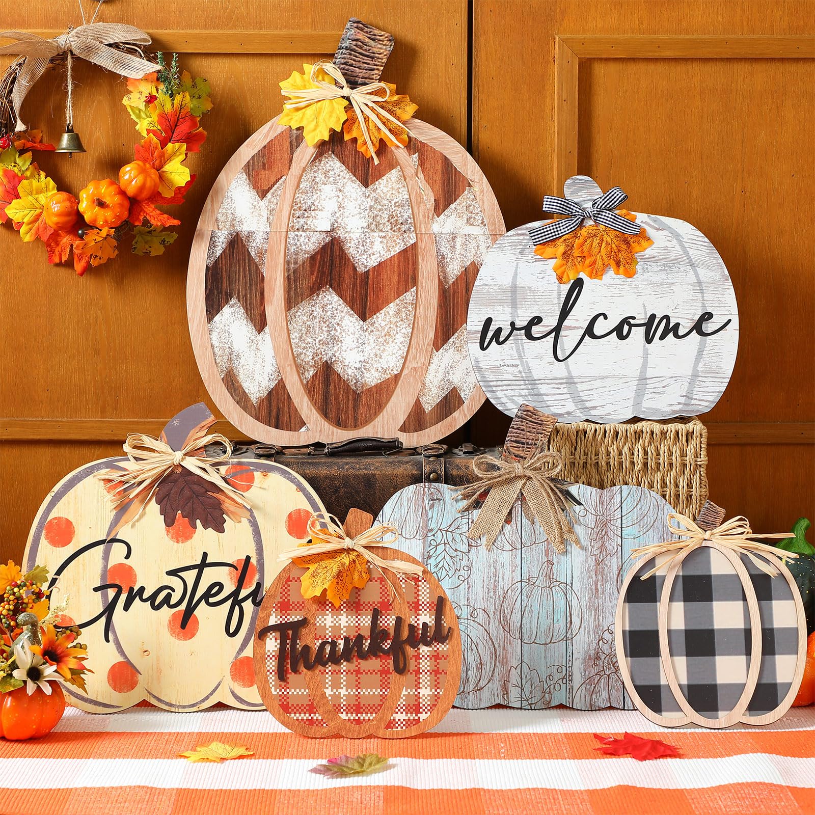 Moucuny pumpkin signs in a garden setting with autumn leaves