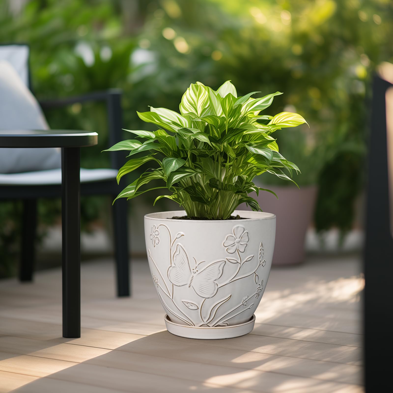 MPotTo Ceramic Planter Pot in a garden setting with plants