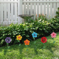 Multiple hogardeck garden stakes displayed in a vibrant garden