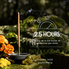 Murphy's Naturals Citronella Sticks burning in outdoor setting