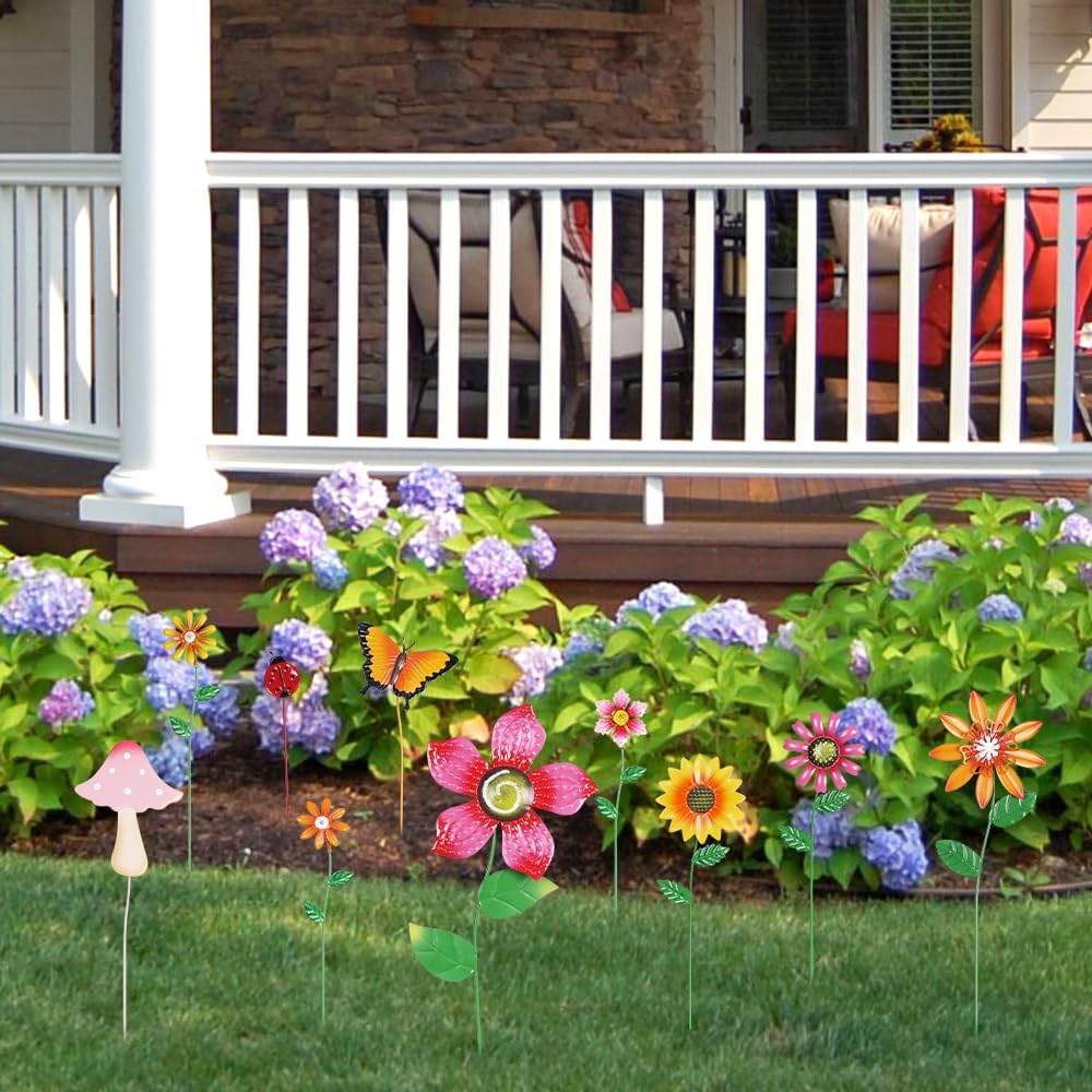 Mushroom decorative garden stake by hogardeck in a flower bed