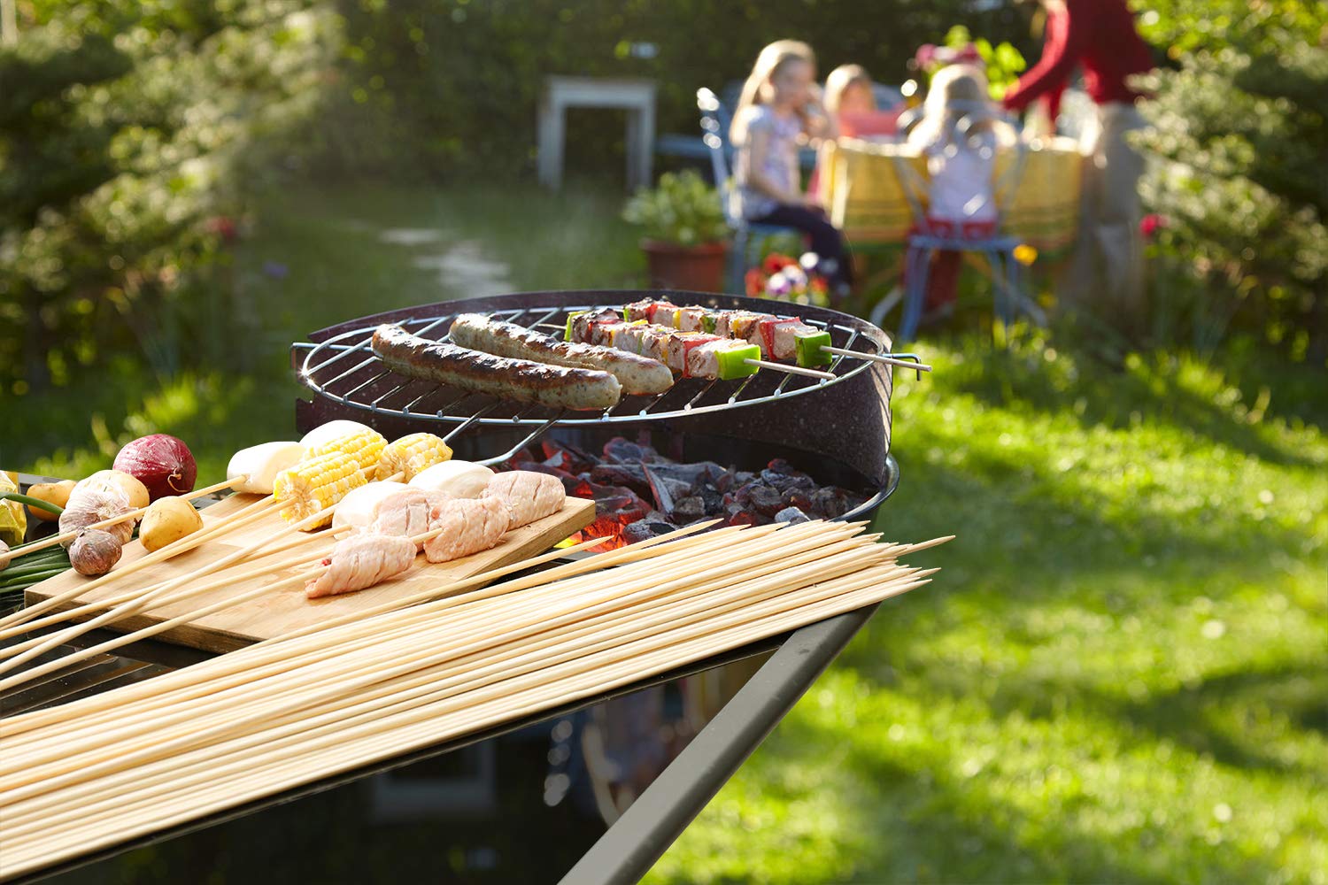 NadaKin bamboo skewers displayed on a picnic table with food