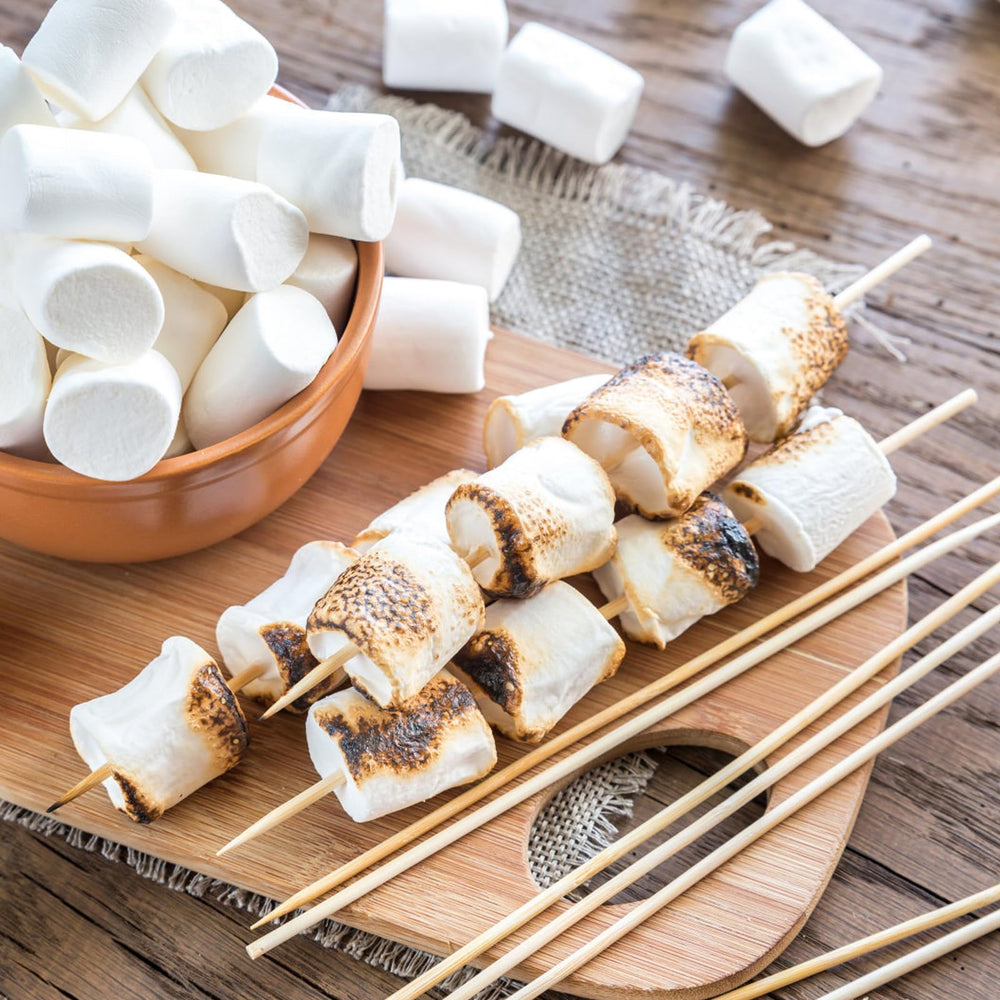 NadaKin roasting sticks being used for grilling hot dogs