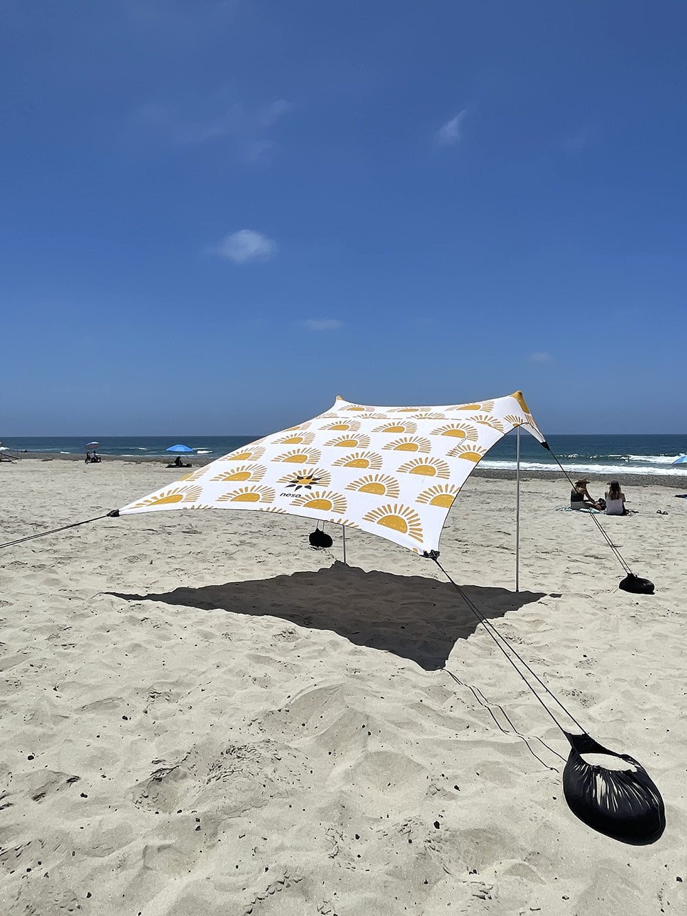 Neso Beach Tent setup on the beach with family