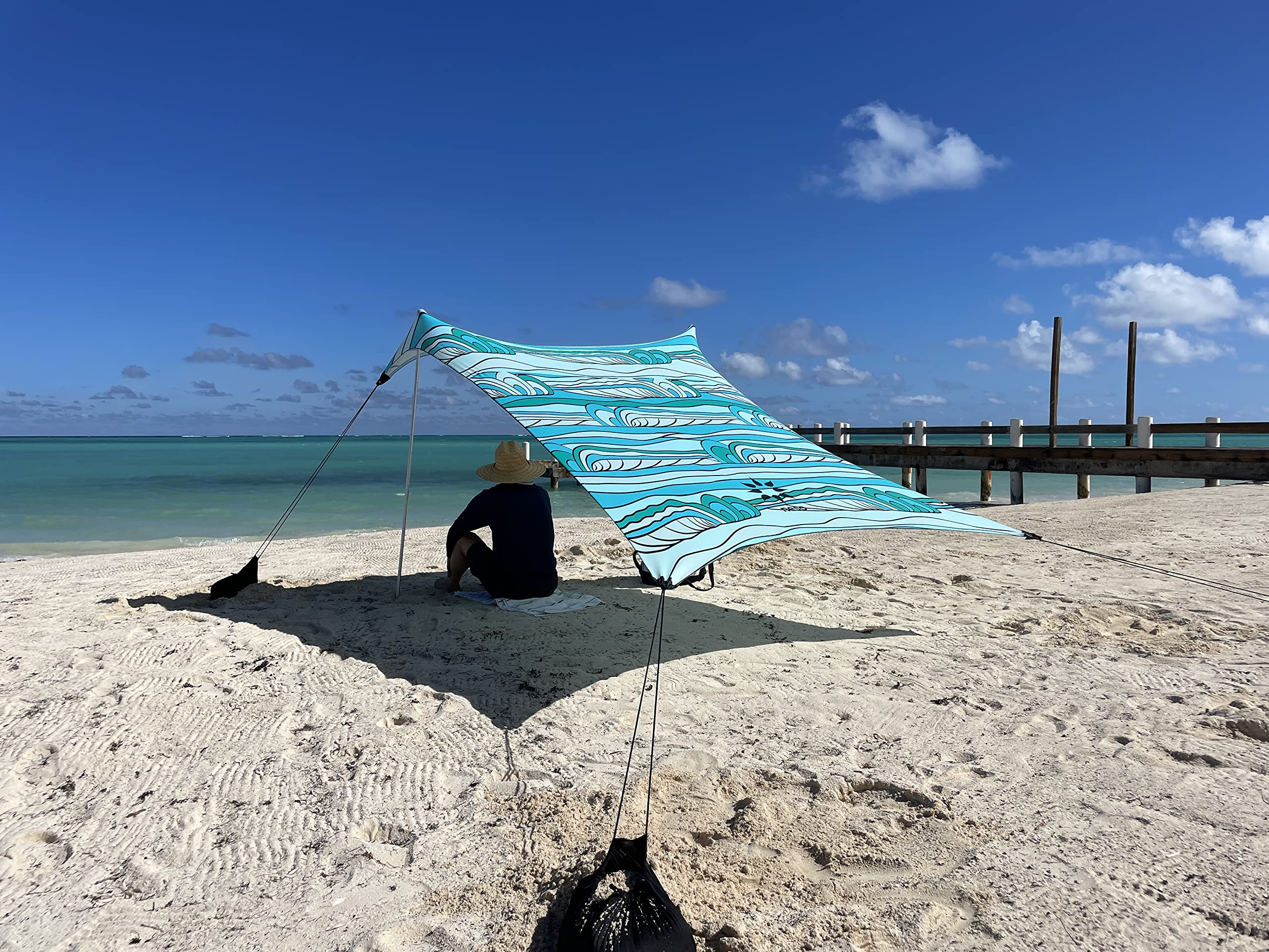 Neso Beach Tent setup with family at the beach