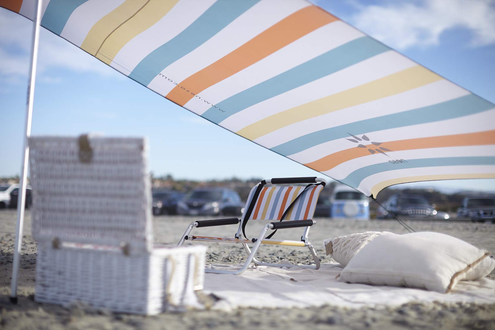 Neso Portable Beach Tent anchored with rocks