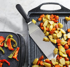 New Star Foodservice Grill Turner in use with burgers