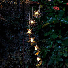 Night view of Tryme Solar Wind Chimes glowing