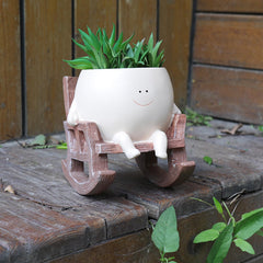 NINIPAPA Smiley Face Planter with a cactus inside on a table