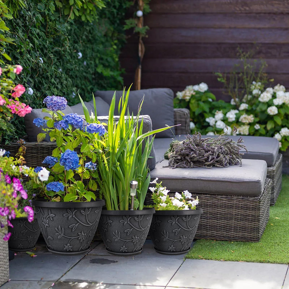 Nooulap 10 inch flower pot in a garden setting