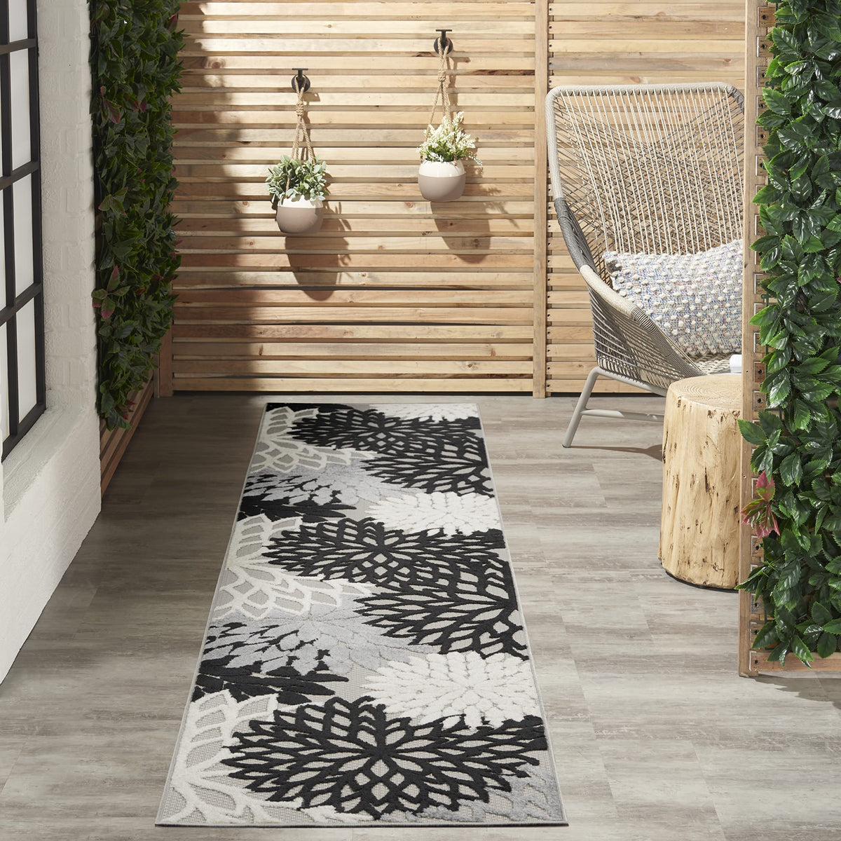 Nourison Aloha 2'3" x 10' area rug in black and white floral design
