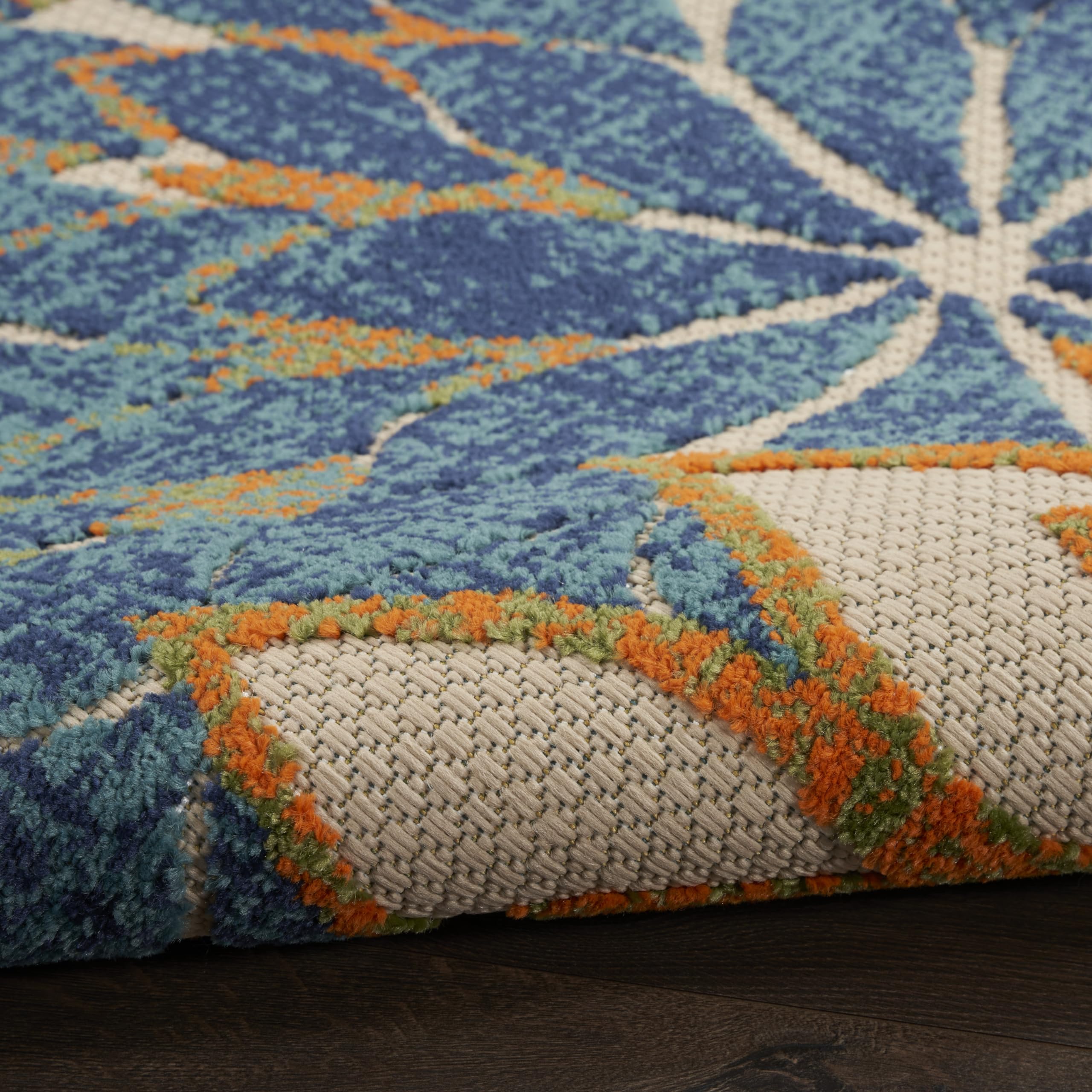 Nourison Aloha Area Rug being rinsed with a hose