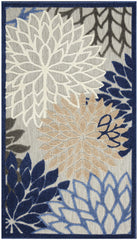 Nourison Aloha area rug on patio showcasing vibrant blue and multicolor