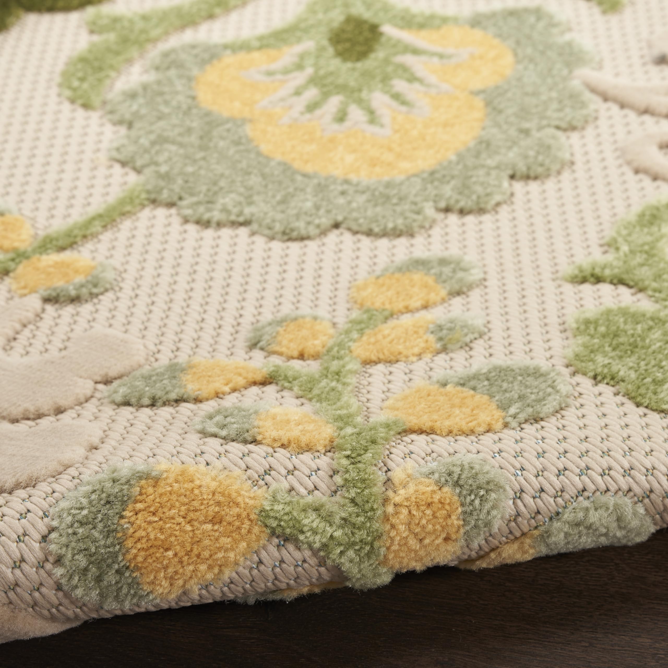 Nourison Aloha Outdoor Rug being rinsed with a hose