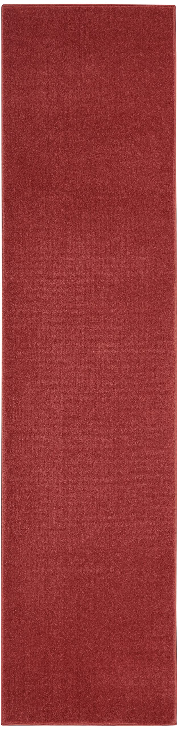 Nourison Brick Red Outdoor Runner Rug layered with another rug